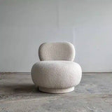 Fotoliu tip pouf din boucle, forma compacta si confortabila, stil contemporan