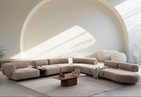 Canapea colțar Aura cu linii rotunjite și confort premium, perfectă pentru spații elegante și luminoase
